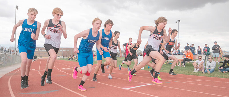 Korbyn Warren (right) explodes off the line during the 1600 meters on Saturday in Cowley. He finished second in the race, starting just ahead of Colin Walker (left) and Nathan Varian (center) at the Rocky Mountain Invite.