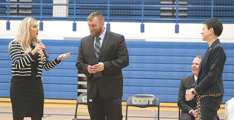 State Superintendent of Public Instruction Megan Degenfelder (left) chats with Cody High School Principal Nathan Tedjeske and Stephanie Bishop, the vice president of the Milken Educator Awards, on Wednesday. Tedejske was given the Milken Educator Award during a surprise assembly as well as a cash prize of $25,000.
