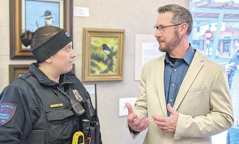 Sweetwater County Sheriff’s Sgt. Jim Rhea visits with Powell Police Officer Jade Euan during an April 25 community reception. This week, Rhea was chosen as Powell’s next police chief.