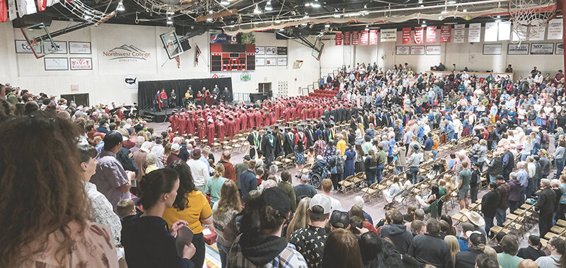 Soon-to-be Northwest College graduates stand during last year’s commencement ceremony in Cabre Gym.