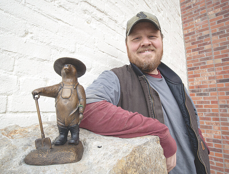 Park County artist Tanner Loren shows off the first Bears in the Basin statue at the Powell Commons. There are 18 bears in Park County sponsored by Cody Yellowstone for new trail to encourage local and non-resident visitors to spend more time in the county&rsquo;s downtowns.