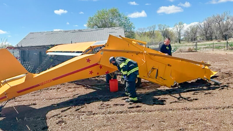 First responders tend to the scene of a Friday morning plane crash east of Powell. While the plane suffered significant damage, there were no injuries.