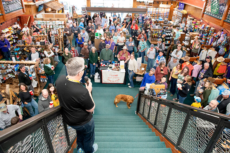 Sunlight Sports co-owner Wes Allen speaks to a full house during its annual Community Night last month. The retail store donates 2% of its yearly profit to nonprofit organizations in the area centered around getting people outdoors.