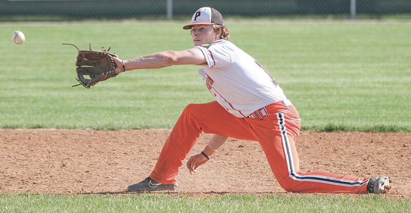 Brock Johnson fields a ball at shortstop during the second game against Laurel on Saturday. He had a strong first game on the mound against the Dodgers, recording 15 strikeouts in the win.