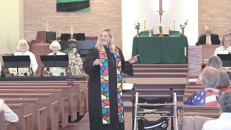 Rev. Janita Krayniak speaks to her congregation and members of neighboring churches during the service to deconsecrate the First United Methodist Church in Powell. The members are joining in a federation with the Union Presbyterian Church and are working to come up with a new name.