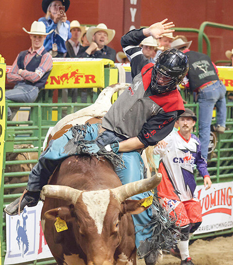 Chris Staley tries to hang on to his bull during the CNFR in Casper. He was unable to post a score for the Trappers during his three attempts.