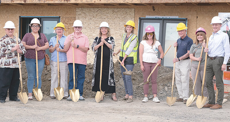 Members of One Health and its board of directors hold golden shovels during the Powell branch’s groundbreaking at the former Fitch Building on June 26. From left, board member Beth Hronek, board Vice President Sara Pretty Weasel, board member Juanita Sapp, board President Marty Thone, Associate Vice President of Medicine and Behavioral Health Dr. Sarah Sowerwine-Fitzgerald, Chief Financial Officer Colette Mild, Clinical Operations Director Ashley Jarrett, former board member Tom Bibbey, Intake Supervisor Rayven Moore and One Health CEO David Mark.