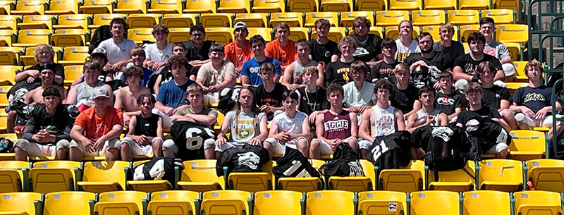 An exhausted Panther football team takes a picture in the stands after winning the team competition at the Black Hills State University camp in early June.