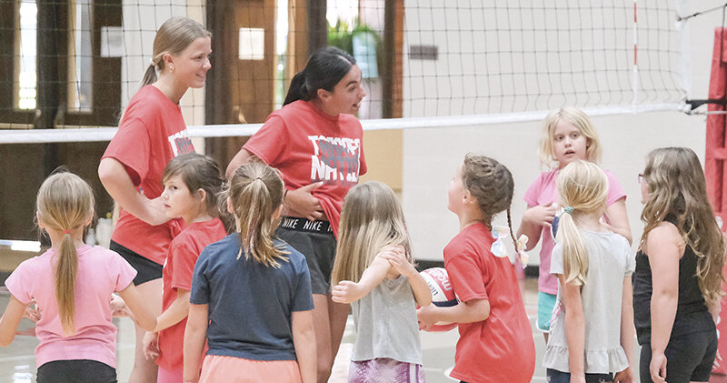 Incoming Trapper freshmen Holland Stowe of Buffalo (left) and Powell&rsquo;s Kenzie Fields instruct young athletes during the All Skills Camp at Northwest College.