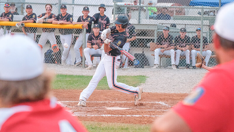 Jordan Loera swings through a pitch against the Lovell Mustangs on Sunday night. Powell rallied late once again to hold off the Mustangs 8-4.