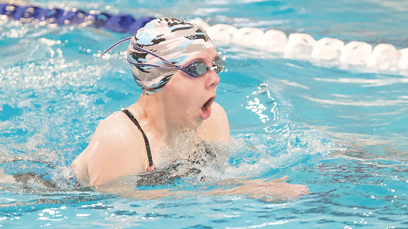 Brooke Brown comes up for a breath during breaststroke drills at the Panther swim camp in late July.