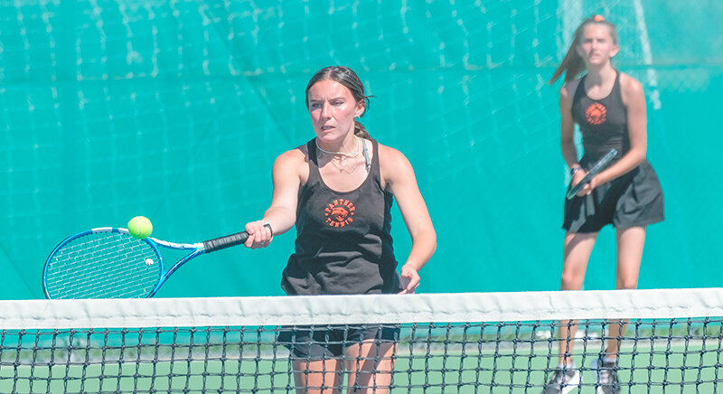 Isabelle Urbach plays a ball at the net during the Panthers&rsquo; match against Sheridan on Aug. 31. Urbach and partner Alaina Kousoulos earned a victory at No. 1 doubles against Torrington on Saturday.