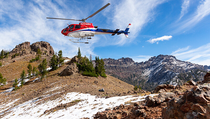 A Yellowstone helicopter drops a ground team on Eagle Pass as part of the search effort for a missing concessionaire employee.