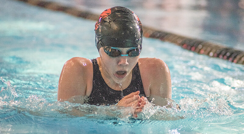 Brooke Brown comes up for a breath during the 200 IM in Buffalo on Saturday, Powell returns home for its final meet of the season tonight (Tuesday).