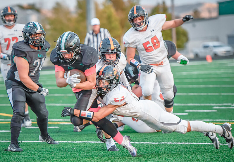 Jordan Loera dives to tackle a Green River runner near the goal line during the first half of the Panthers’ contest against the Wolves on Friday.