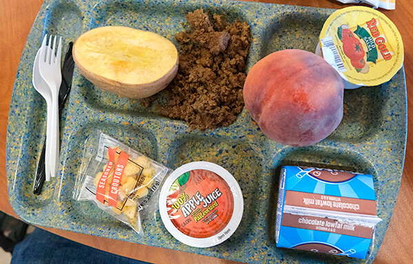 A student’s tray shows fresh ingredients sourced by PCSD1 for Farm to School Day.