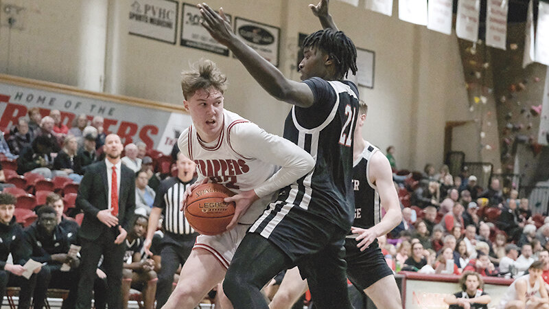Drew Larson (left) tries to work his way in the post against a Casper College defender during the Trappers&rsquo; game on Jan. 16. Larson averaged 27 points in the Trappers&rsquo; two wins against LCCC and Eastern Wyoming.