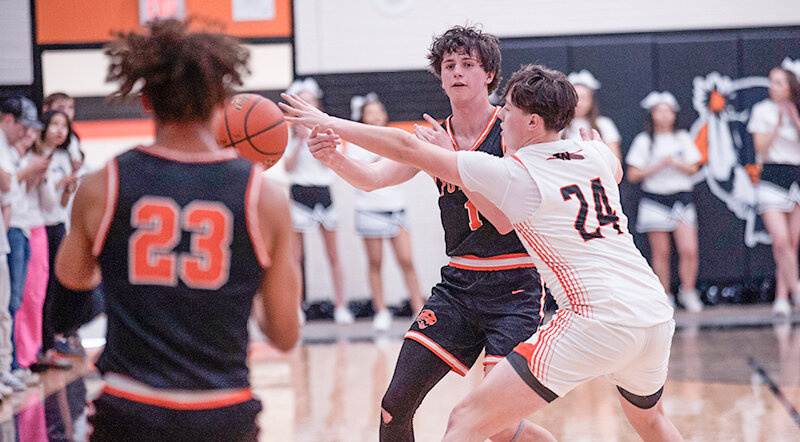 Taeson Schultz passes the ball down to Alex Jordan, as the Panthers staged a second half comeback but fell in overtime to Worland, 78-75.