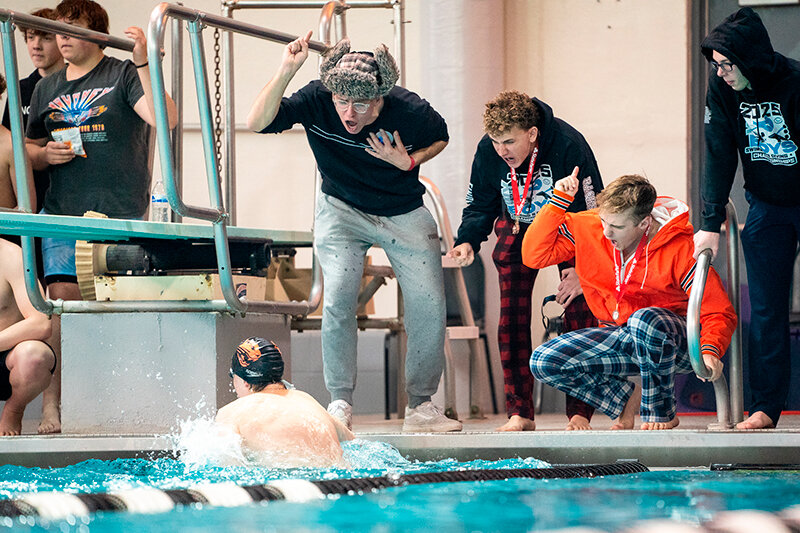 Nate Fuller, Will Fuller, Conner Mayes and Tyler Kruger cheer on Trystan Preator as he makes a turn during the state championships in Gillette. Powell ended up fifth as a team behind strong performances at the state meet.