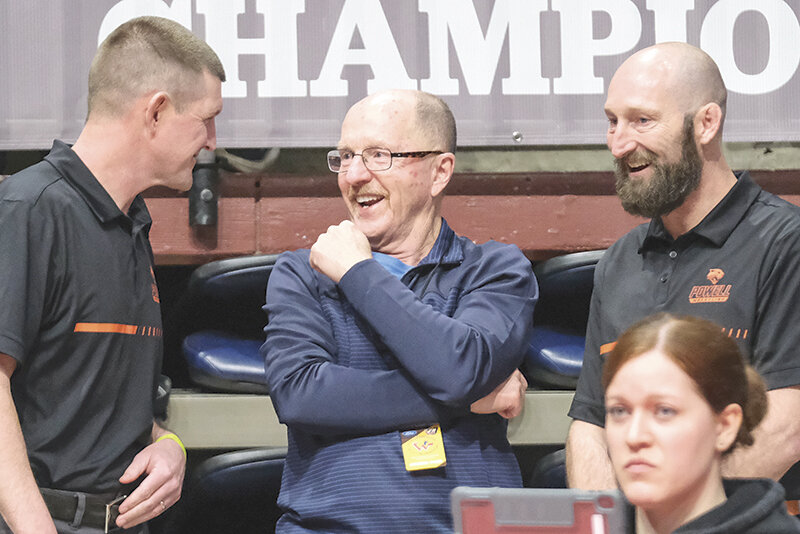 Ron Laird (center) was inducted into the National Federation of High School Associations’ 2025 National High School Hall of Fame Class. Laird continues to support the Powell Panthers even in retirement and is seen here talking with Panther wrestling coaches Nick Fulton (left) and Juston Carter at the state tournament in Casper earlier this month.
