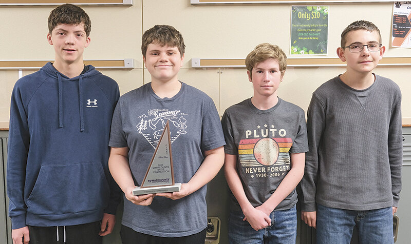 Powell Middle School’s state champion Mathcounts team poses with their trophy. Two of the students will be attending nationals in May. From left, Brady Kuenn, Huston Dearcorn and national qualifiers Hayden Peters and Cody Bozell.