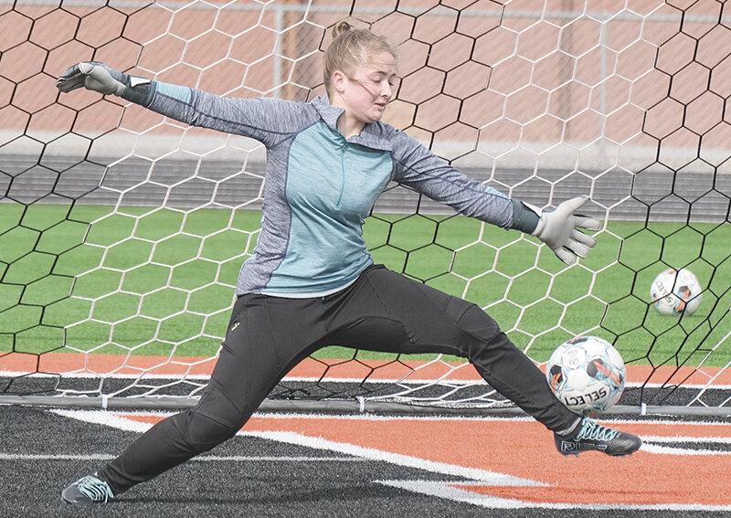 Junior Josie Hallock returns in net for the Panthers this season, as she attempts to save a shot during practice on Thursday.