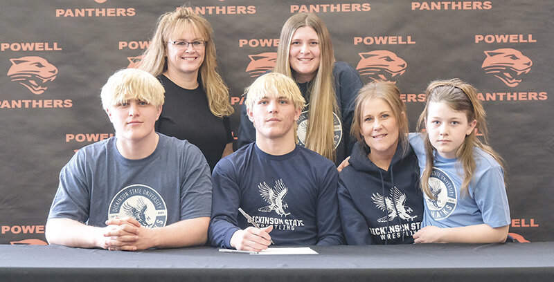 Mitchel Wainscott signed his letter of intent on April 9, to continue wrestling with Dickinson State University. Wainscott was joined by family and friends including from left: Denton Wainscott, Toni Wainscott (behind), Mitchel, Mycah Wainscott (behind), Desiree Pettet and Bristol Pettet. Brandy Pettet and Mike Wainscott are not pictured.
