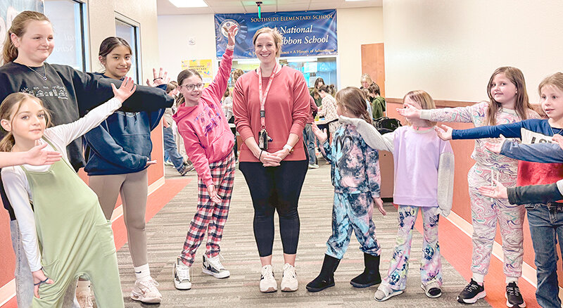 Southside Elementary School music teacher Kati Sears celebrates with students after being named the North Big Horn Basin Music Educator of the Year earlier this month.