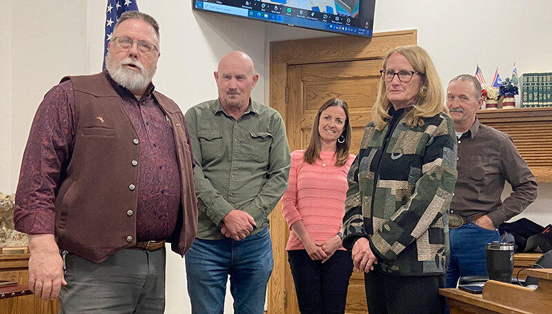 Retired Park County Public Health Nurse Bill Crampton (from left) speaks to a crowd of coworkers and others after being thanked for his service by Park County commissioners Scott Mangold, Kelly Simone, Dossie Overfield and Lloyd Thiel.