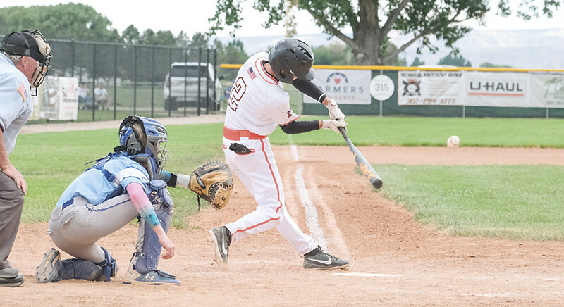 Talon Nuss swings through a pitch at the plate during the Pioneers’ first game against Cody on Tuesday. Powell fell just short 5-4 and 2-0 in the doubleheader against its Park County rivals.