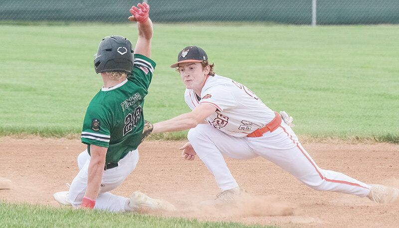 Ryan Barrus reaches out to tag a runner trying to steal second during a win over Green River on Tuesday. Powell swept the visiting Knights to earn two conference wins.