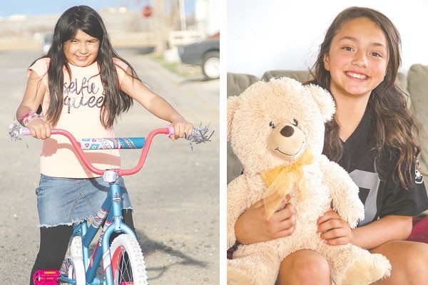At left, Anai Torres is all smiles as she gets ready to ride her new bike. Anai was disappointed when her number wasn’t picked in a drawing for a new bicycle at Saturday’s Easter egg hunt at the fairgrounds, but she ended up a winner after all when Kyla Del Bosque spontaneously gave her the bike she won. At right, Kyla Del Bosque poses with the teddy bear she received from Anai Torres.