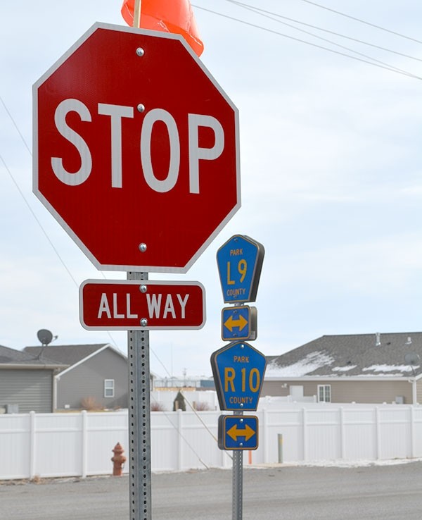 Two stop signs were recently added to the intersection of Lane 9 (aka Avenue E) and Road 10 (Tower Boulevard), making it an all-way stop.