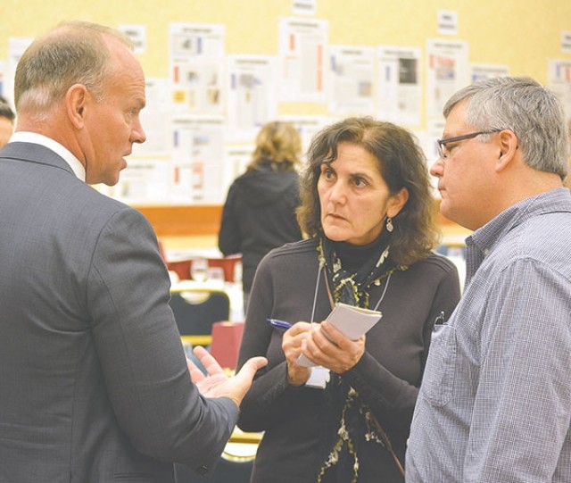 Gov. Matt Mead gestures as he chats with (from right) Lovell Chronicle Publisher David Peck and Chronicle reporter Patti Carpenter at the Wyoming Press Association Winter Convention in Laramie Friday afternoon.