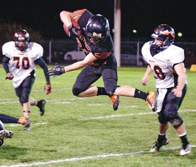 Cory Heny goes airborne to avoid a tackler during a Panther scoring drive in their Homecoming win over Worland Friday night.