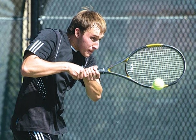 Panther No. 1 doubles player Todd Lewis returns a ball during North regional tennis action in Jackson. The Panther boys placed fourth at the event and will head to Gillette this week for state play.