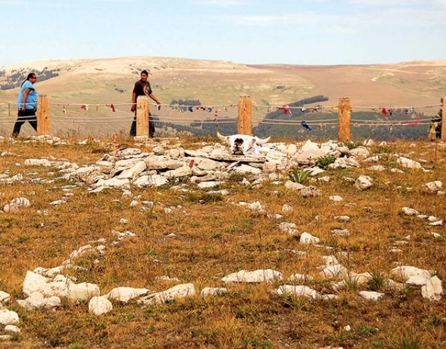 Larry Ironhand (left) and Troy Fast Horse, circle the Medicine Wheel in the Big Horn Mountains. Native Americans and many others consider the wheel a sacred place. Recently the national historic landmark was expanded to 4,080 acres to include Medicine Mountain roughly to the east of the wheel.