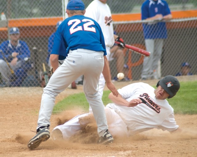 Jacob Beuster slides across home plate during Tuesday afternoon American Legion baseball action for the Pioneers. A seven-game win streak came to an end as Sheridan swept the team by 9-3 and 5-4 final scores.