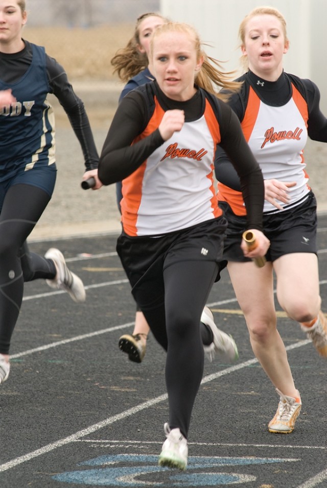 Kadi Cooley takes off after receiving the baton from Karly Thomas on the second leg of the girls’ 4x100 relay on Saturday. Despite missing some points in key events, the Panther girls placed third as a team in Lovell.