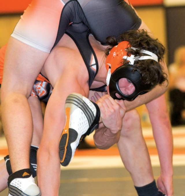 Powell Panther 160 pound wrestler Olie Olson, shown competing in Worland last weekend, is one of five Panthers who have been ranked number one in their weight-classes among 3A wrestlers in Wyoming. Olson wrestled with the mask last weekend while a cut lip sustained in the Powell Invitational heals.