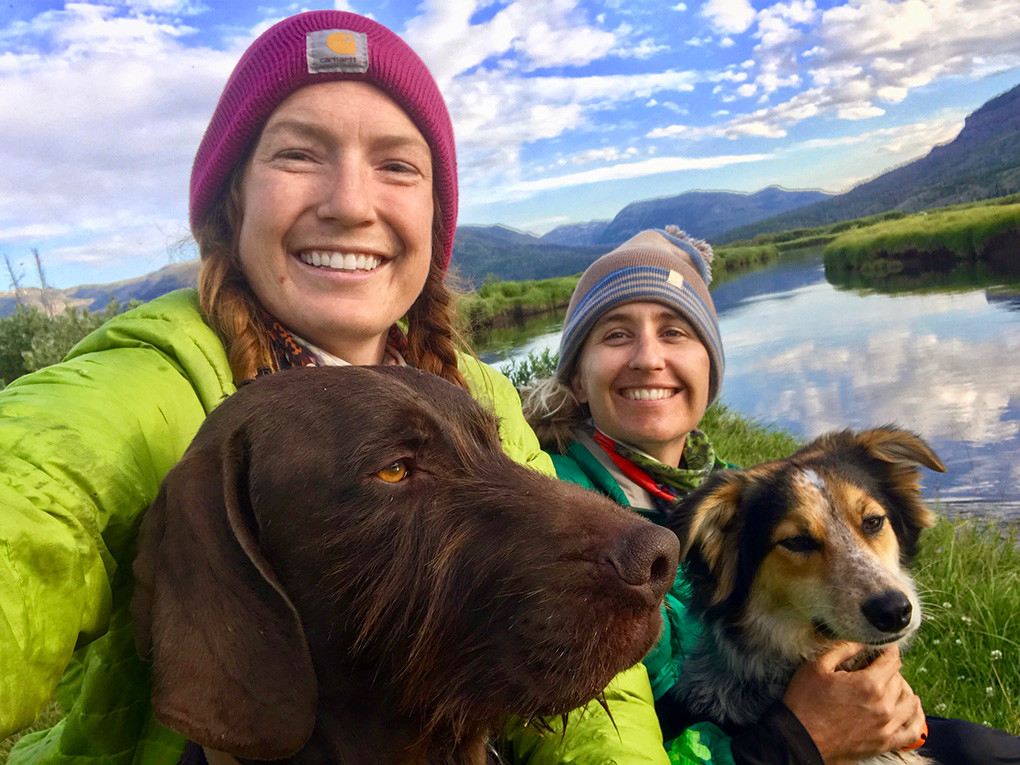Virginia Schmidt (left), her friend Jessica Williams and their dogs Peter (left) and Penny pose for a selfie near their Day 4 campsite, on the Yellowstone River at Hawk’s Rest, otherwise known as Bear Box Row.