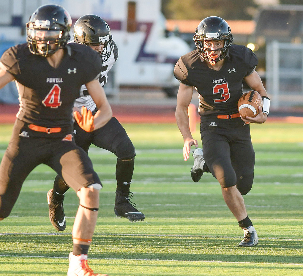 Panther quarterback Ethan Asher (No. 3) follows the block of teammate Dalton Woodward against Jackson during the final game of the season at Panther Stadium last month. Asher was named Most Valuable by his teammates at Tuesday’s awards ceremony at Powell High School.