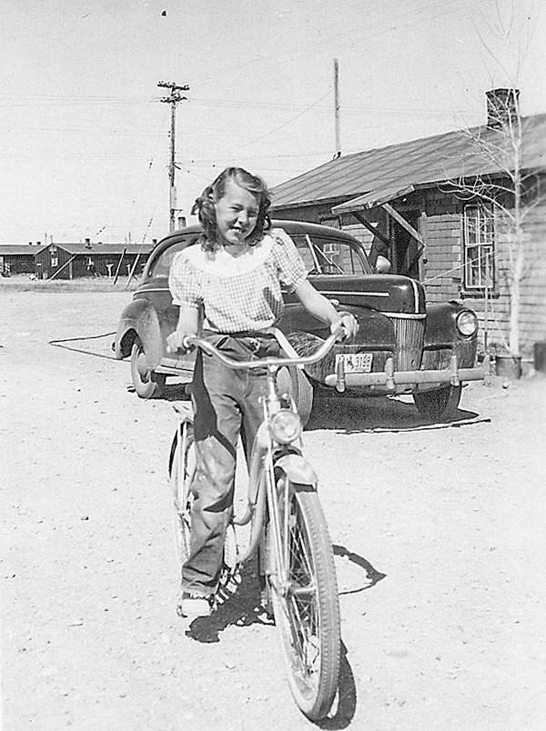 Columnist Pat (Reher) Stuart is pictured outside her family’s barrack at the site of the former Heart Mountain Relocation Center.
