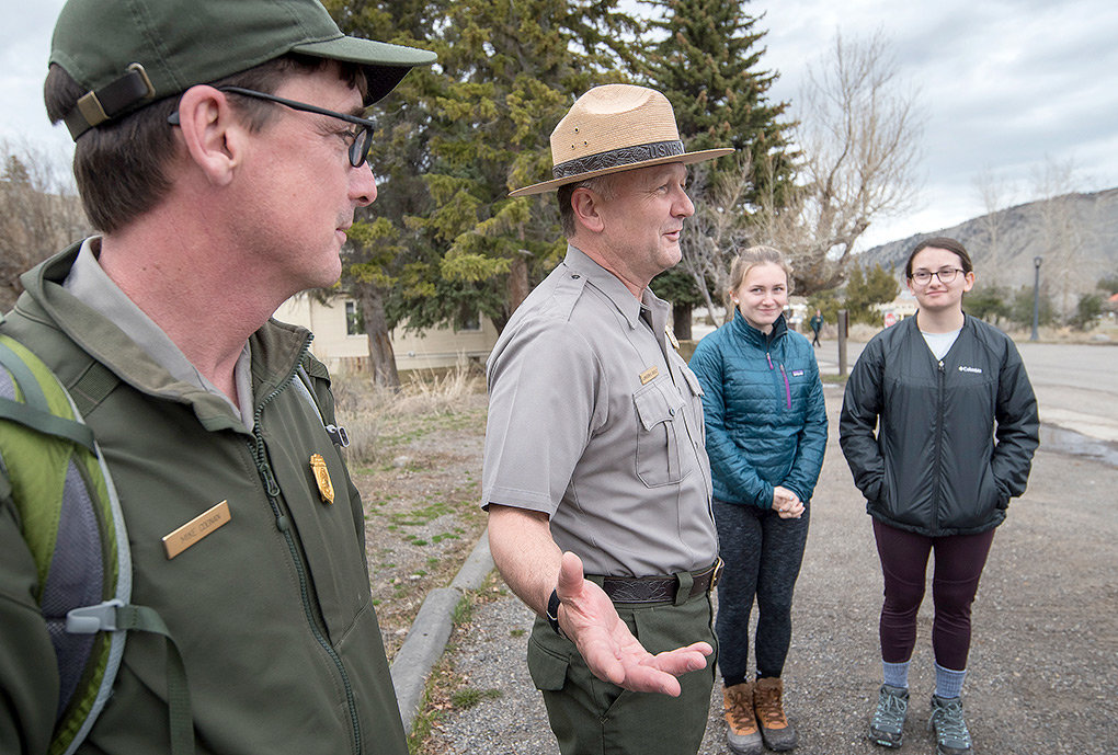 New Yellowstone National Park Superintendent Cameron ‘Cam’ Sholly talks with a group of visiting students from New York alongside park employee Mike Coonan (left) last week. After arriving in October, Sholly is entering his first summer season at the park.
