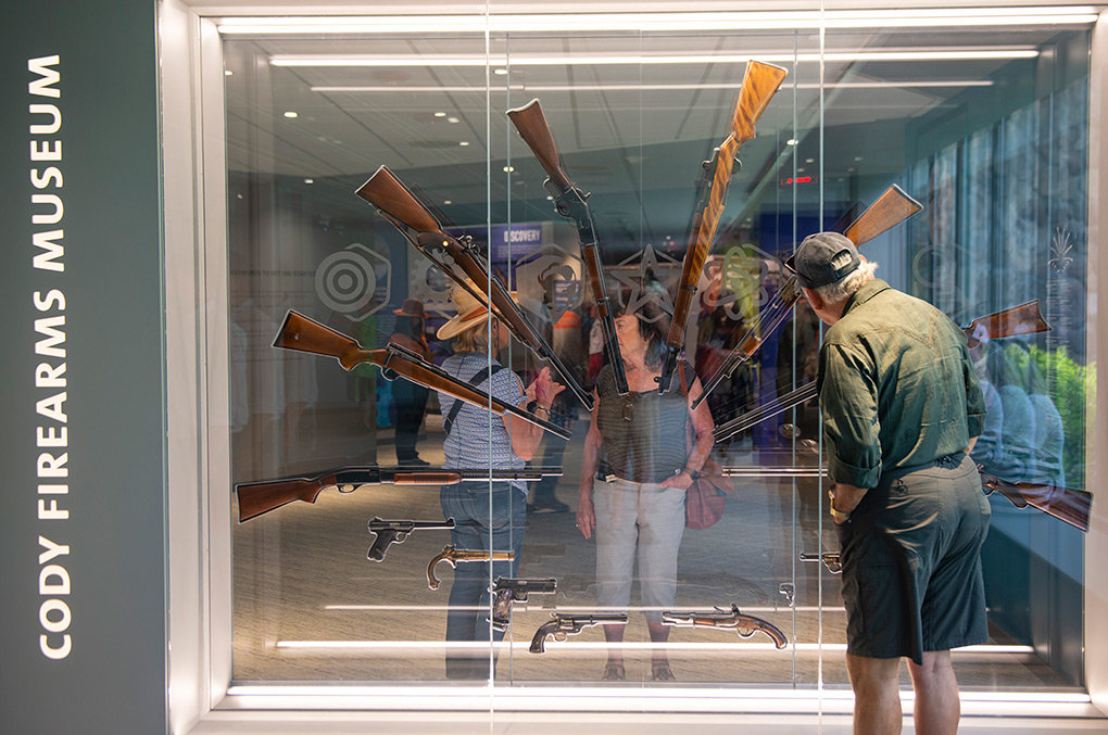 Visitors check out a display near the entrance of the newly renovated Cody Firearms Museum during Saturday’s grand opening at the Buffalo Bill Center of the West.