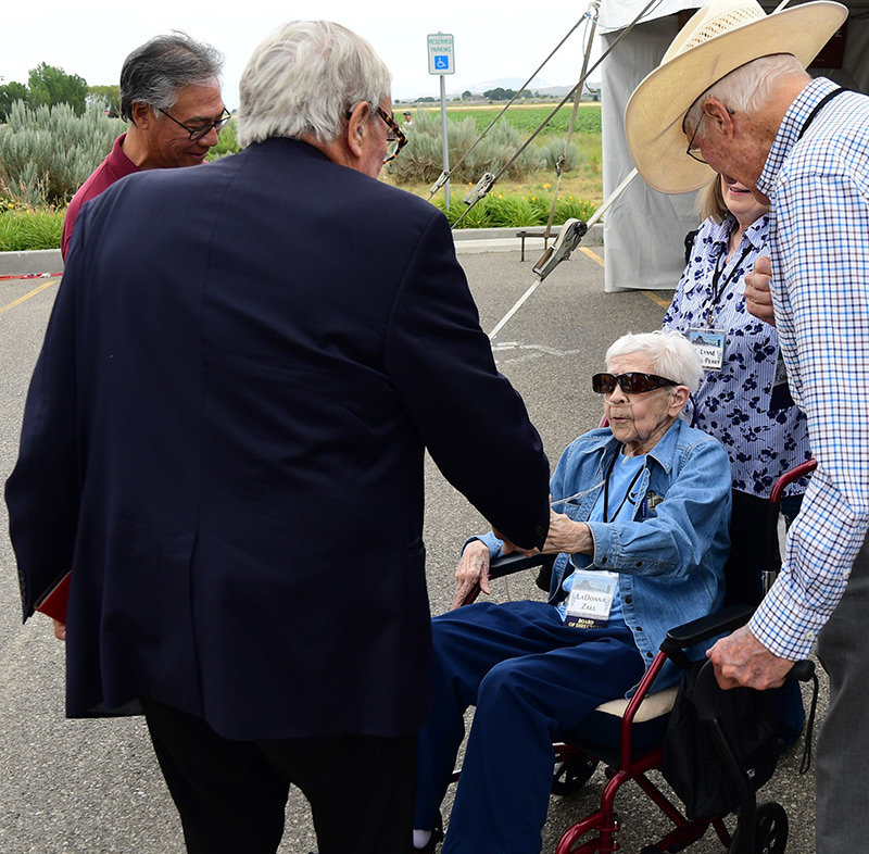 LaDonna Zall shakes hands with Tom Brokaw during a quiet moment at last weekend’s Heart Mountain Pilgrimage. Brokaw was presented with the Compassionate Witness Award at the event, named in Zall’s honor.