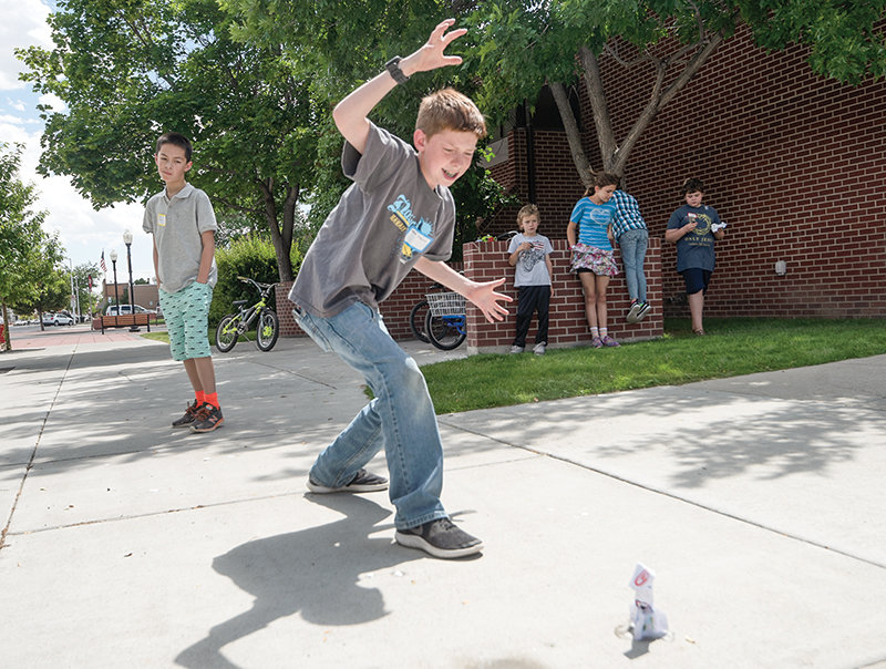 During a program on bubble rockets at the Powell Branch Library this summer, Sam Yount waits for his rocket to lift off. Park County libraries provided $480,779 worth of programs and classes during the last fiscal year.