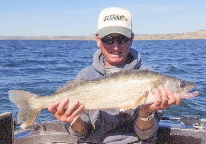 Local angler Mark Nuss poses with a nice walleye he caught at Pathfinder Reservoir a couple of summers ago. Nuss and fishing partner Lynn Stewart of Casper finished fifth at the annual Wyoming Walleye Stampede In-State Championship Tournament last month at Seminoe Reservoir.