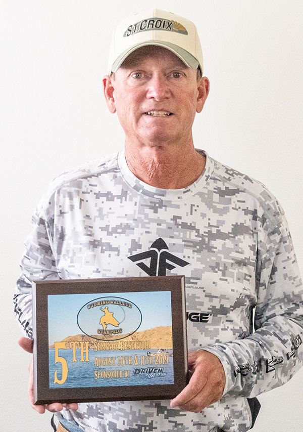 Angler Mark Nuss shows off his plaque for finishing fifth at the annual Wyoming Walleye Stampede In-State Championship Tournament last month.