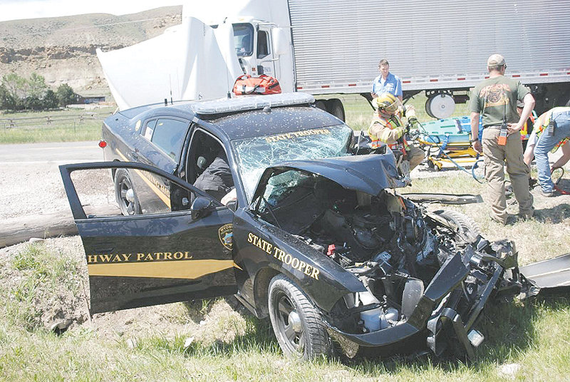 Emergency crews had to extricate then-Wyoming Highway Patrol Trooper Rodney Miears from his patrol car after this crash in the Wapiti area in 2015. Miears later was medically retired from his job as a trooper and moved to a different position with the patrol.